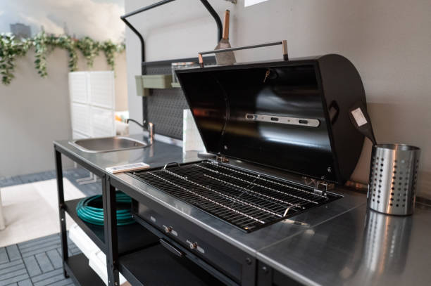 Modern outdoor kitchen featuring a clean and ready-to-use barbecue grill