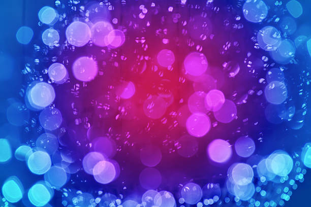Defocused christmas colorful abstract background with space for text. New Year blurred bokeh neon background