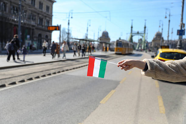 Close-Up of a Woman's Hand Holding the Hungarian Flag