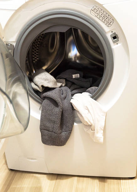 things in the washing machine. white and gray colors