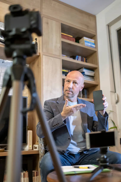 istock An adult influencer recording a tutorial for his blog at home 2206558948