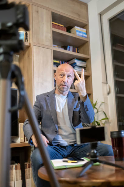 istock An adult influencer recording a tutorial for his blog at home 2206558960