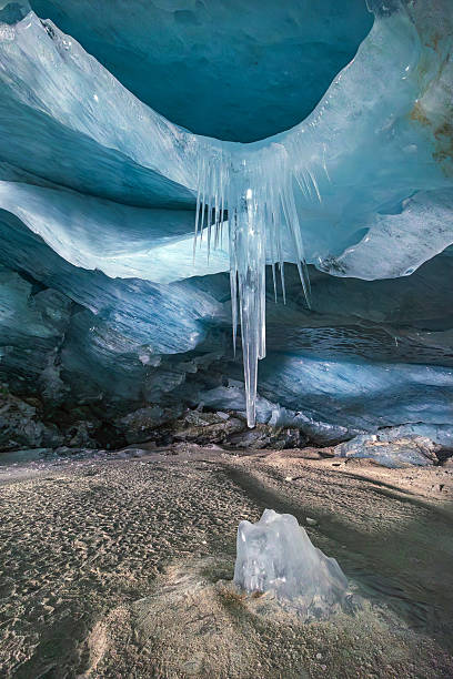 Huge icicle hanging from an ice cave ceiling