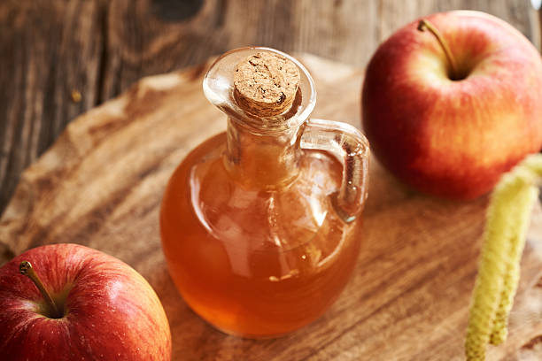 istock Apple cider vinegar in a glass bottle 2206560406