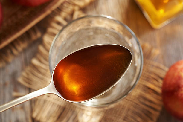 istock Apple cider vinegar ion a metal spoon 2206560455