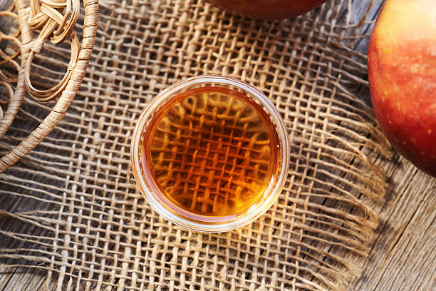 istock Apple cider vinegar in a glass bowl, top view 2206560509