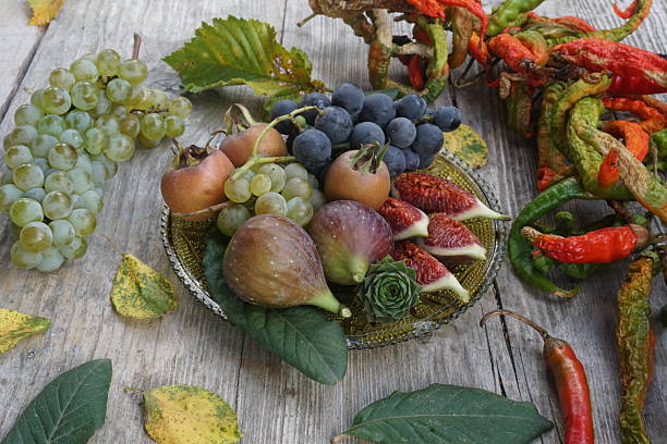 istock Assorted Fruits and Dried Chilies on a Wooden Plate 2206561585