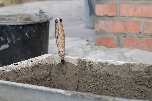 istock A metal trowel with a wooden handle. 2206561985