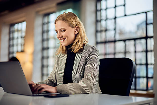 istock Professional Female Working on a Laptop in a Modern Office Setting 2206569064