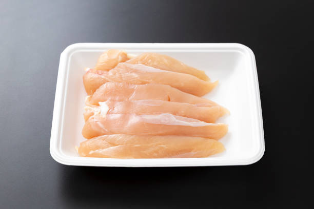 istock Chicken fillet on a black background. 2206580518