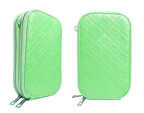 istock two views of a mint green purse or small bag with diamond stitching pattern and double zipper, placed on a white background. One view from the side and one from the front. 2206581151