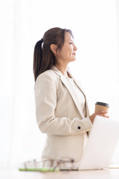 istock young asian businesswoman using laptop,break 2206583470