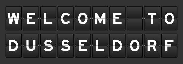 istock Black color analog flip board with word welcome to dusseldorf on gray background 2206585275