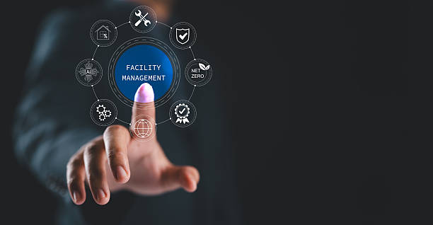 istock Facility management concept. Businessman with facility management icon on virtual screen, building resource management covers activities related to buildings or various locations. 2206585561