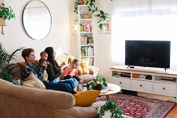 istock Diverse Family Streaming TV with wireless internet 2206599353