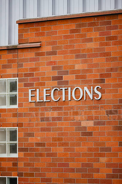 istock Sign on Building that says Elections 2206599386