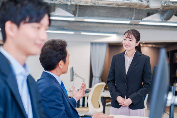 istock Fresh woman assigned to an office and greeting her boss. 2206600643