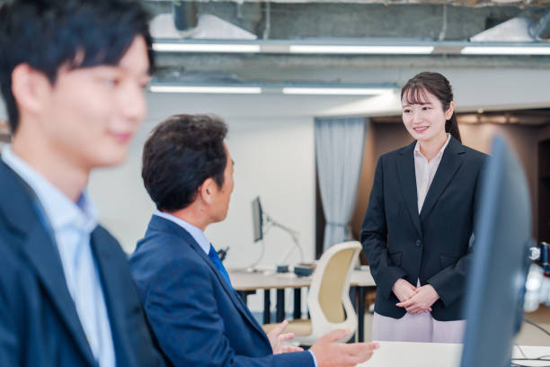 istock Fresh woman assigned to an office and greeting her boss. 2206600645