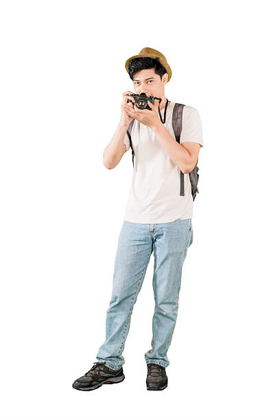 istock Young Male Traveler with Camera and Backpack Isolated on White Background 2206601931