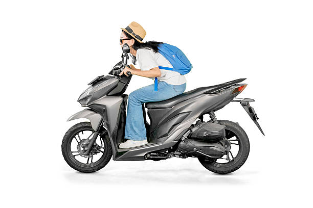 istock Excited Female Traveler Leaning Forward on Scooter in Racing Pose 2206601958