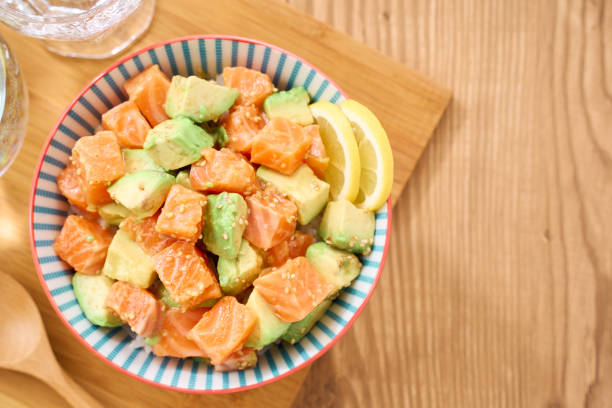 istock Salmon and Avocado Poke Bowl on a Japanese Dining Table 2206608994