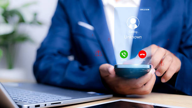 istock Unknown number displayed showing on smart mobile phone. Human use smartphone with incoming call from unknown number, spam, hacker, call center, crime, 2206609554