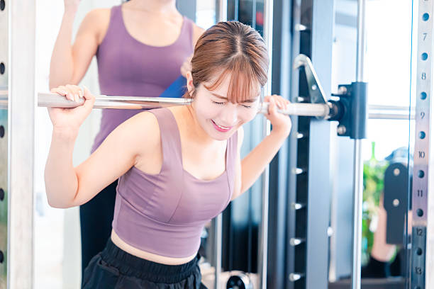 istock Woman undergoing personal training with a female coach at a gym 2206609929