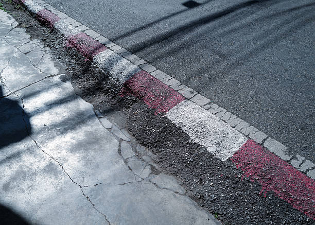 istock Concrete footpath with red and white color sign 2206611185