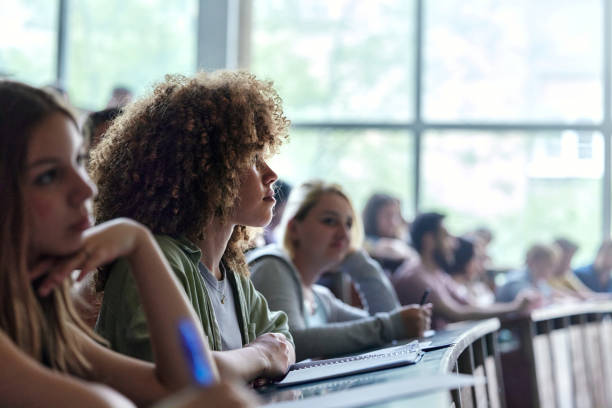 istock Young female student paying attention on a class in amphitheater. 2206615824