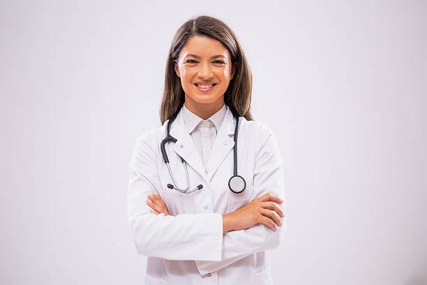 istock Female doctor in front of gray background 2206616431