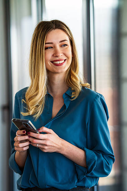 istock Ambitious businesswoman using mobile phone, working at modern office workplace 2206618698