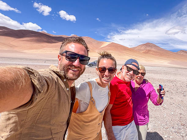 istock Family Selfie: Smiling group enjoys a casual outing in nature 2206618767
