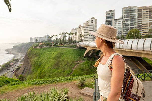 istock Woman Enjoying Scenic Coastal View in Urban Setting, Lima Peru 2206621084