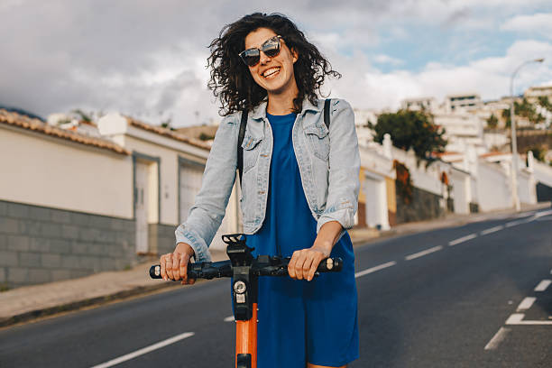 istock Young woman riding an electric scooter 2206623948