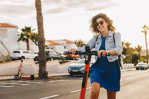 istock Young woman riding an electric scooter 2206623989