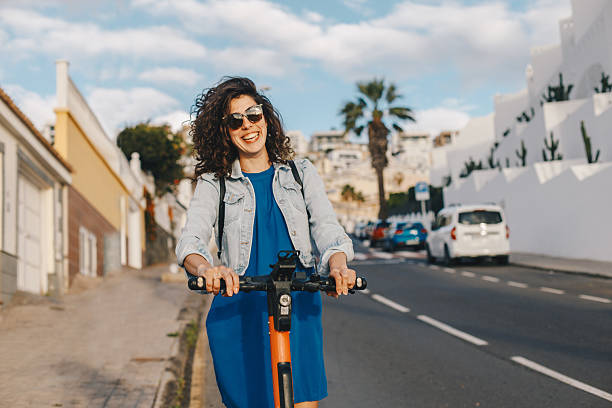 istock Young woman riding an electric scooter 2206623990