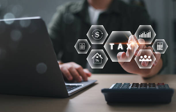 istock Businessman calculating budget, data analysis, documents, reports, tax refund calculation, tax calculation with calculator and laptop. 2206624917