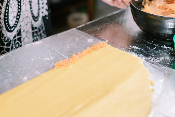 istock Filling the pasta sheet with savory salmon paste for a delicious dish 2206626194