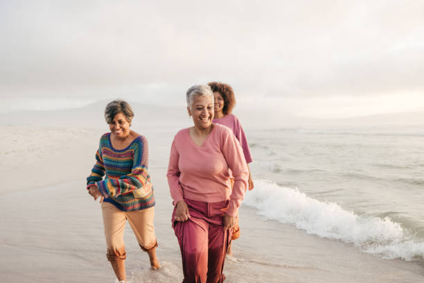 istock Exploring the world and finding joy with friends by the shore 2206626824