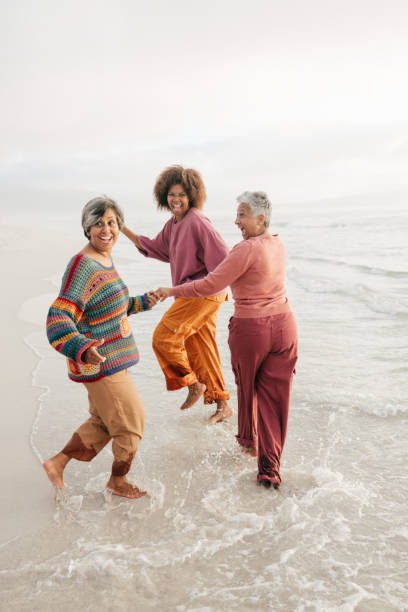 istock Exploring the world and finding joy with friends by the shore 2206626855