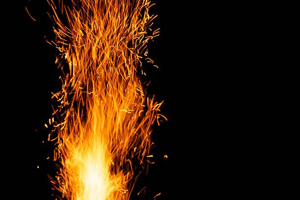 istock sparks from the fire glowing in the dark 2206627000