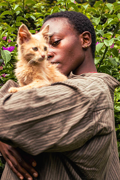 istock A young black woman standing outdoors with a kitten perched on her shoulder 2206628144