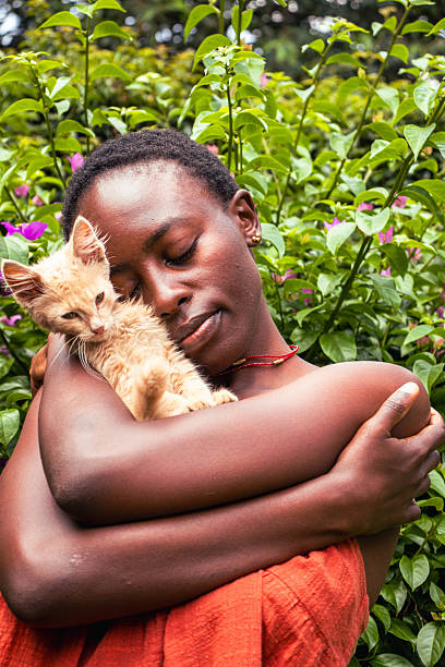 istock A young black woman standing outdoors with a kitten perched on her shoulder 2206628390