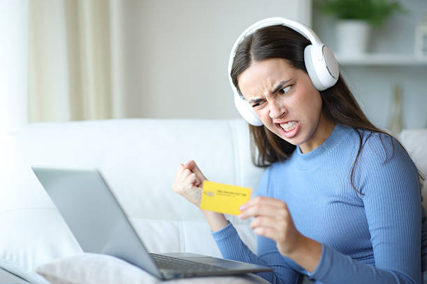 istock Angry woman paying online media content 2206629499