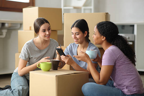 istock Three roommates drinking and planning house renovation 2206629526