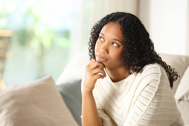 istock Pensive black woman at home 2206629565