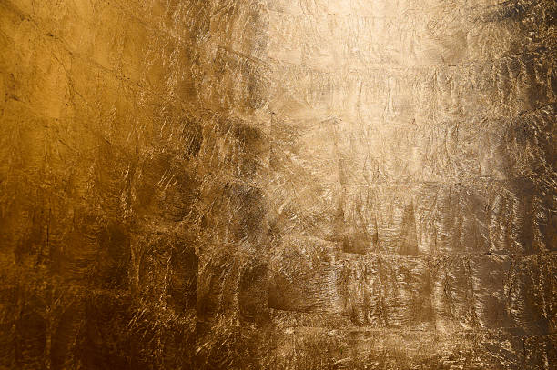 istock Golden textured wall featuring intricate patterns and warm hues in a modern interior setting 2206630689