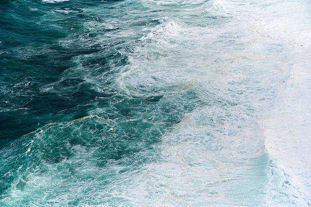 istock Waves crashing on the shore at a coastal location during daylight hours 2206630895