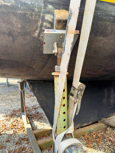 istock Ratchet strap securing sailboat on stand during winter storage 2206630959