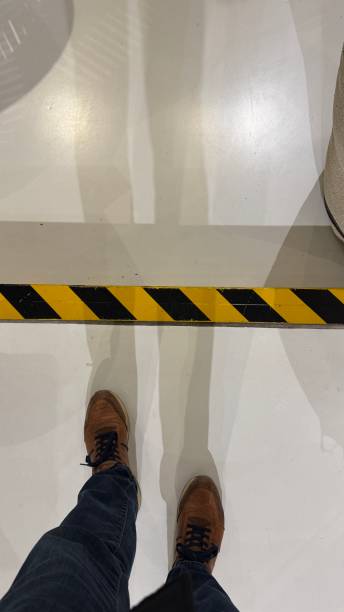 istock Take care Warning, step attention level, striped notices on the floor 2206633396